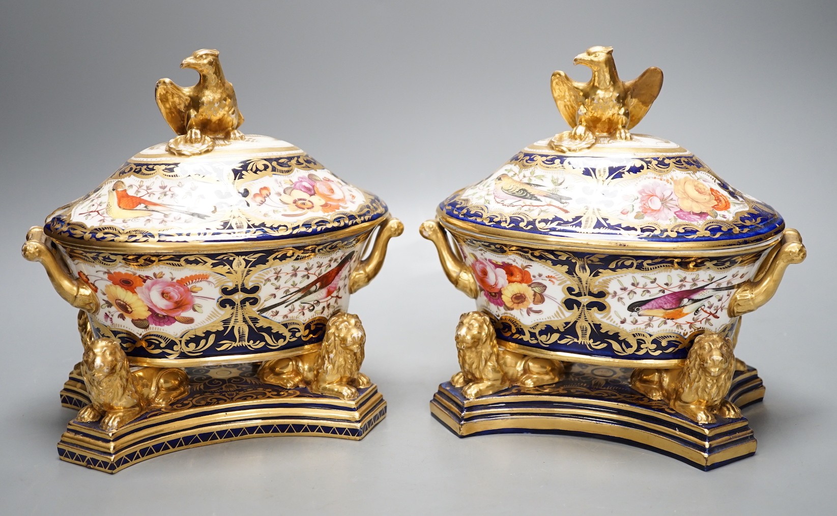 A pair of unusual English porcelain Imari sauce tureens, covers and stands, possibly Coalport c.1820, 19cm tall